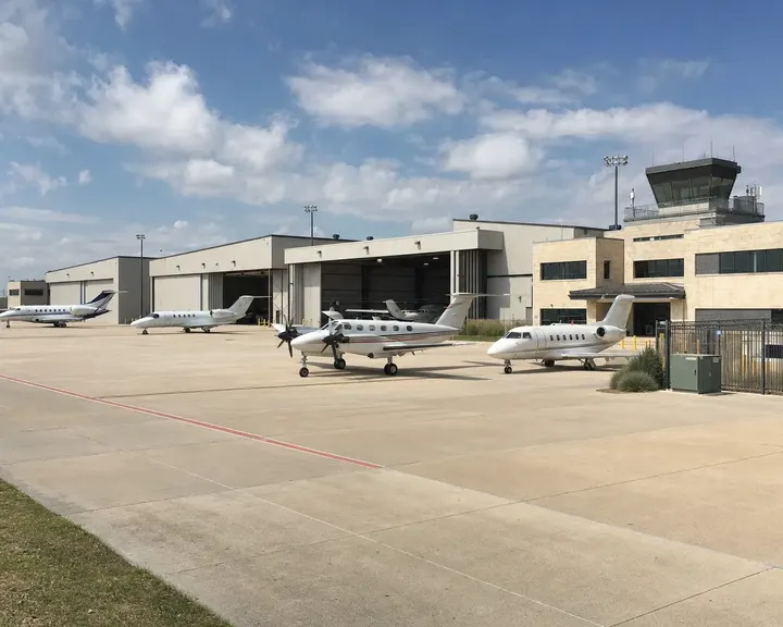 Executive terminal and hangars with control tower at a corporate airport
