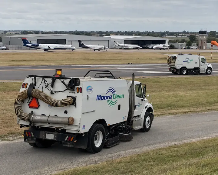 Moore Clean sweepers on a general aviation airfield access road