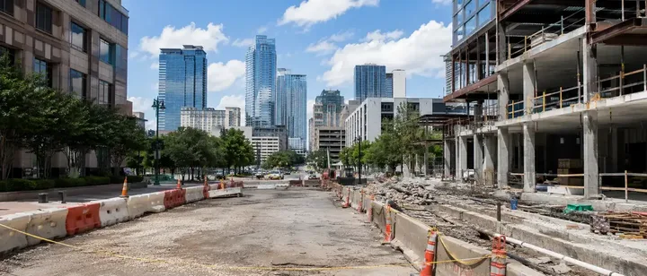 Closed downtown street beside a high-rise under construction