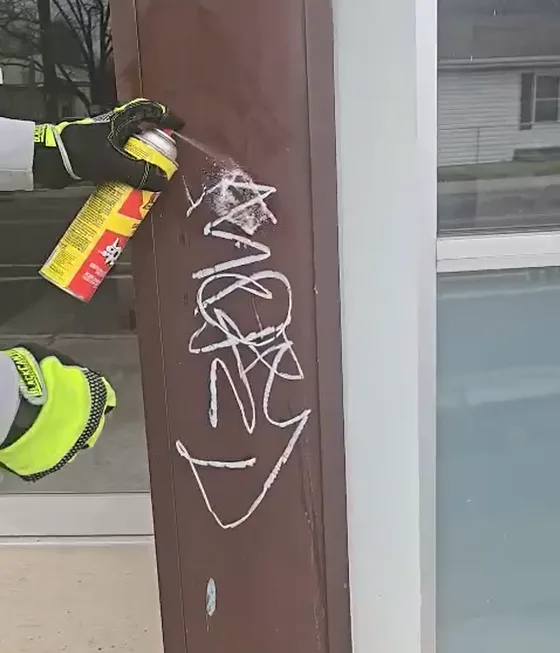 Hand detail work during graffiti removal