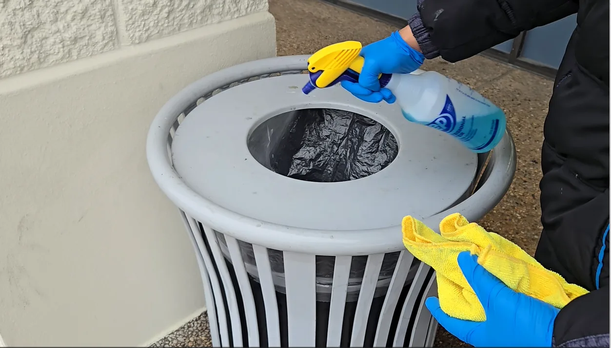 Porter servicing a commercial trash area