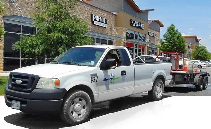 Moore Clean pressure washing rig at a San Antonio retail center