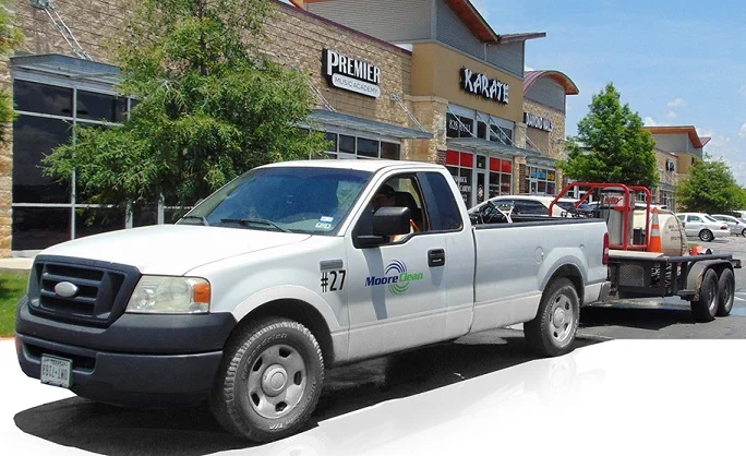 Moore Clean pressure washing rig at a San Antonio retail center
